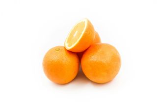 Fresh orange fruit with green leaves