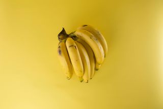 Ripe yellow banana on a dark background